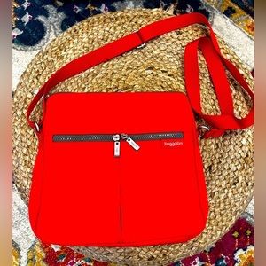 Baggallini red nylon crossbody bag. Adjustable strap. Like new. 10”x10”
